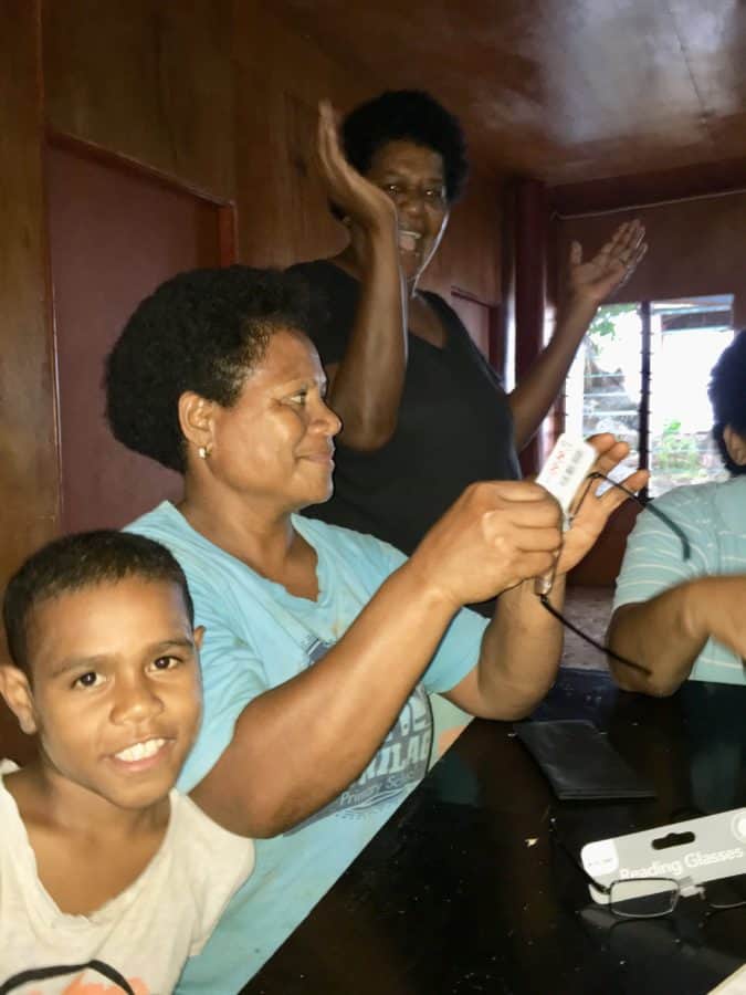 Donating reading glasses in Lavena Island Spirit Fiji