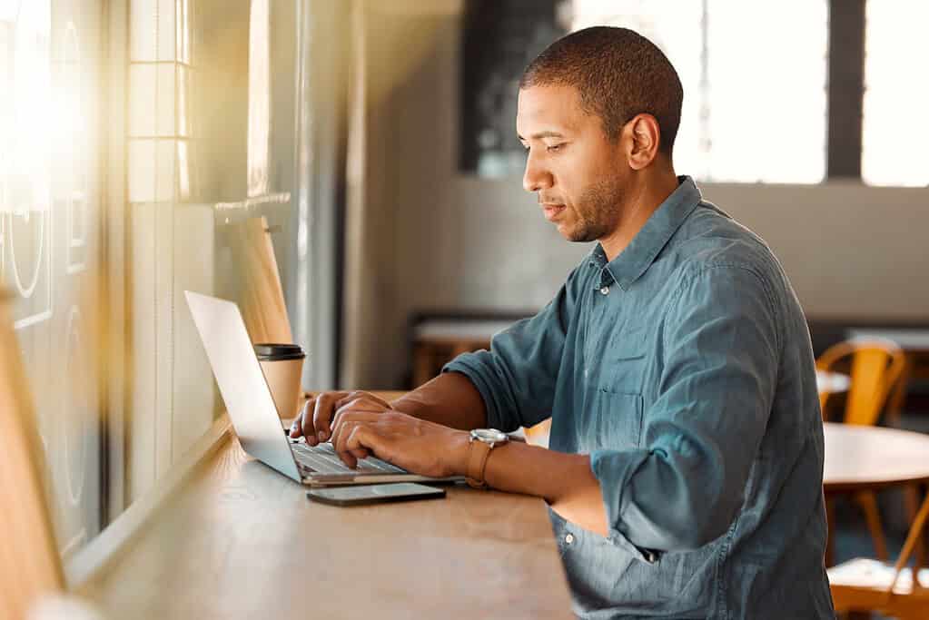 a picture of a man working on his computer