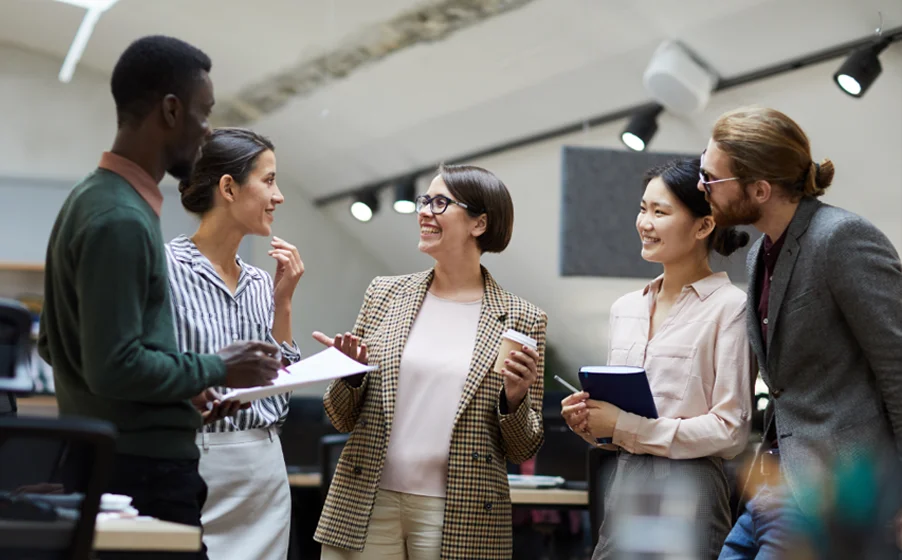 Diverse team collaborating in modern office setting.