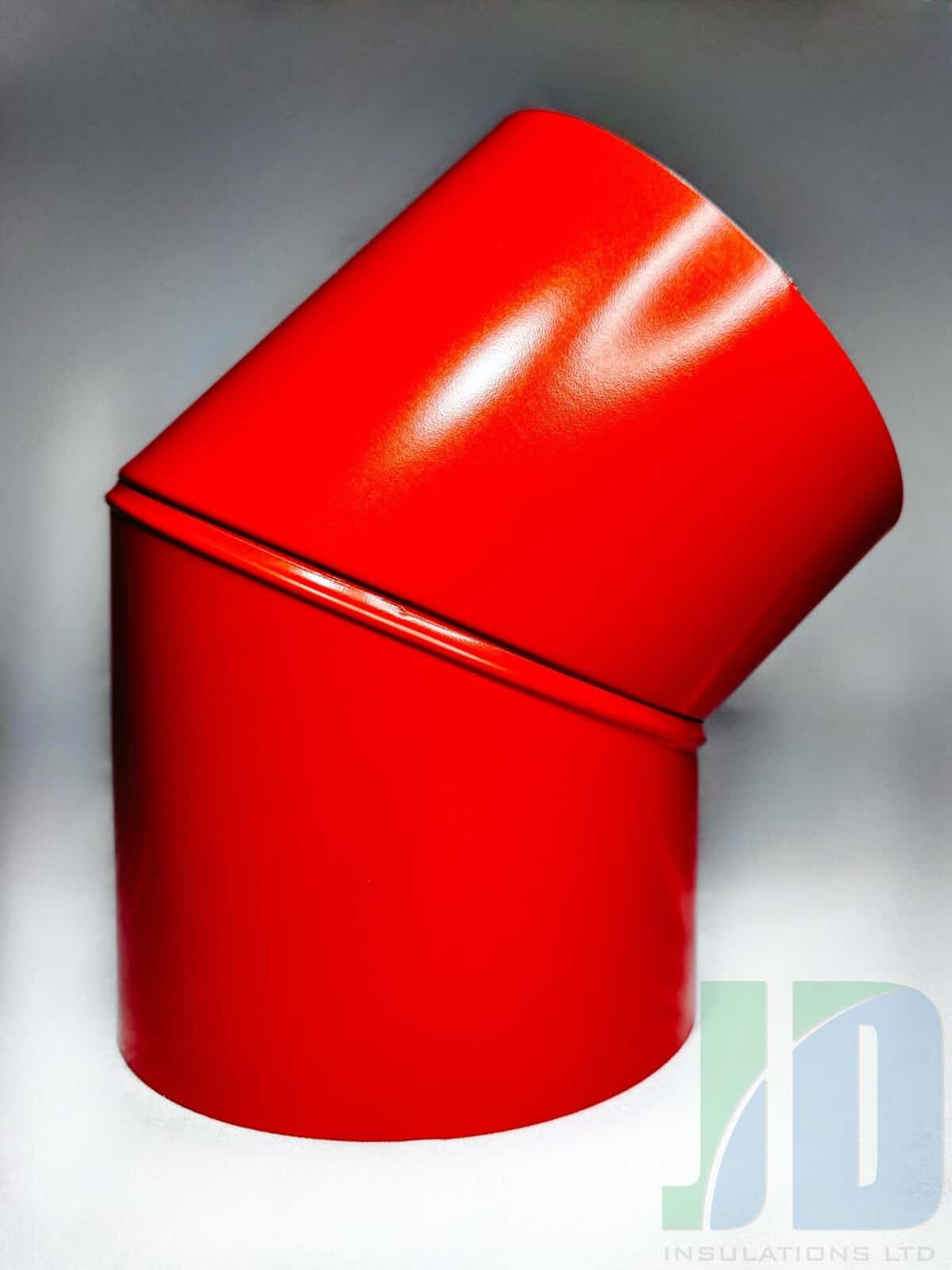 Red metal pipe elbow joint, industrial use.