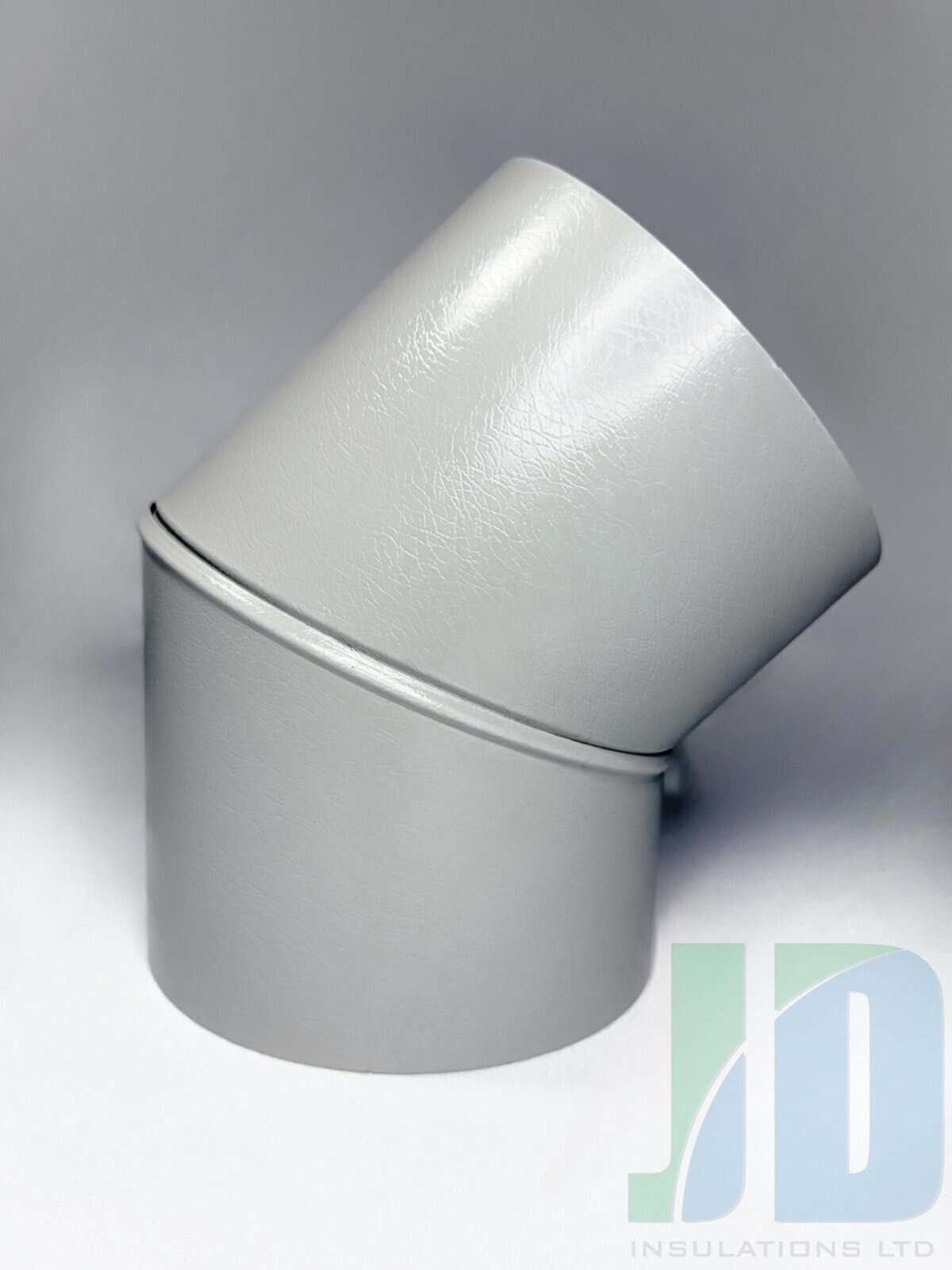 Grey PVC pipe connector for insulation purposes.