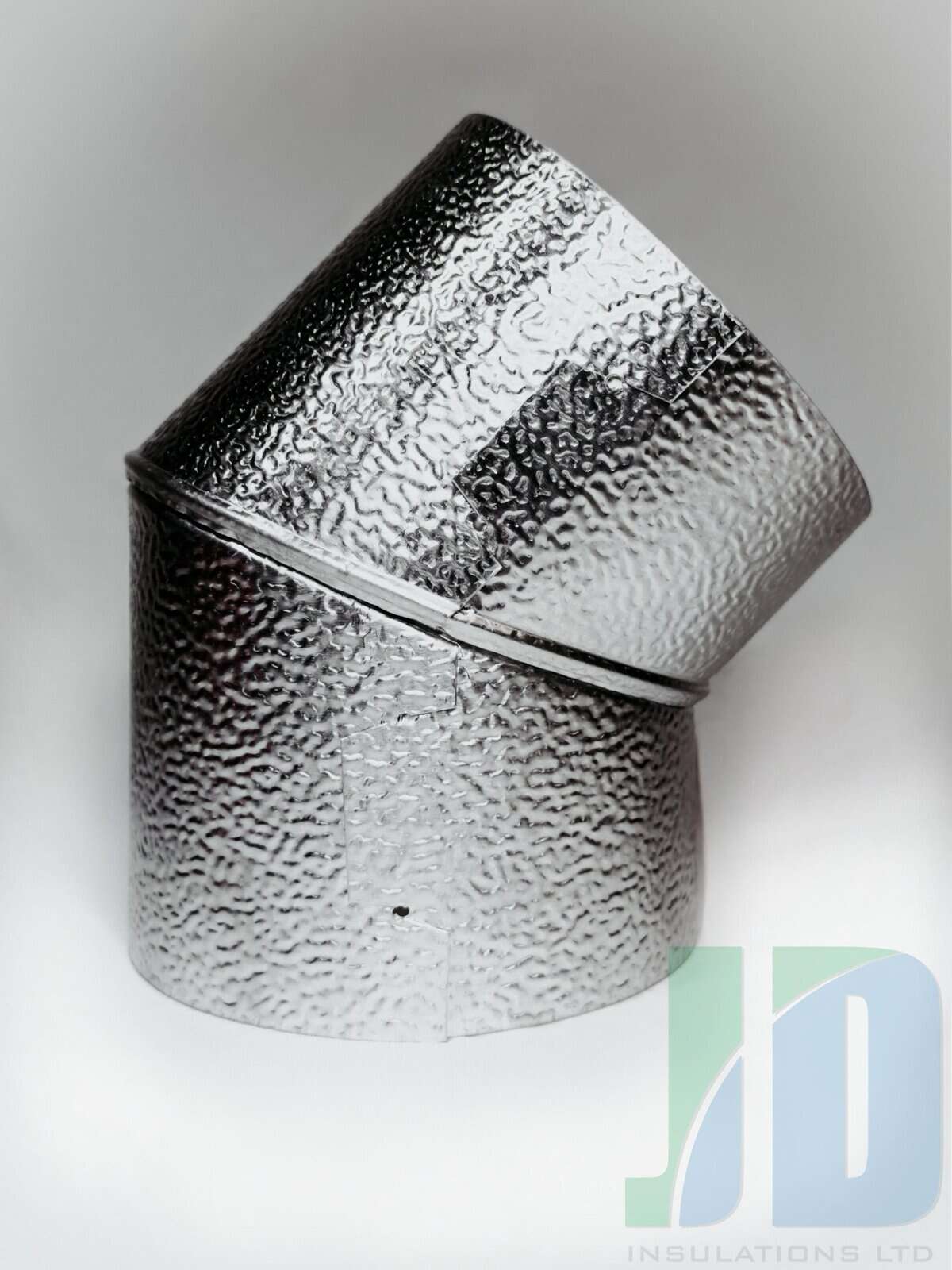 Silver metal duct elbow with textured surface