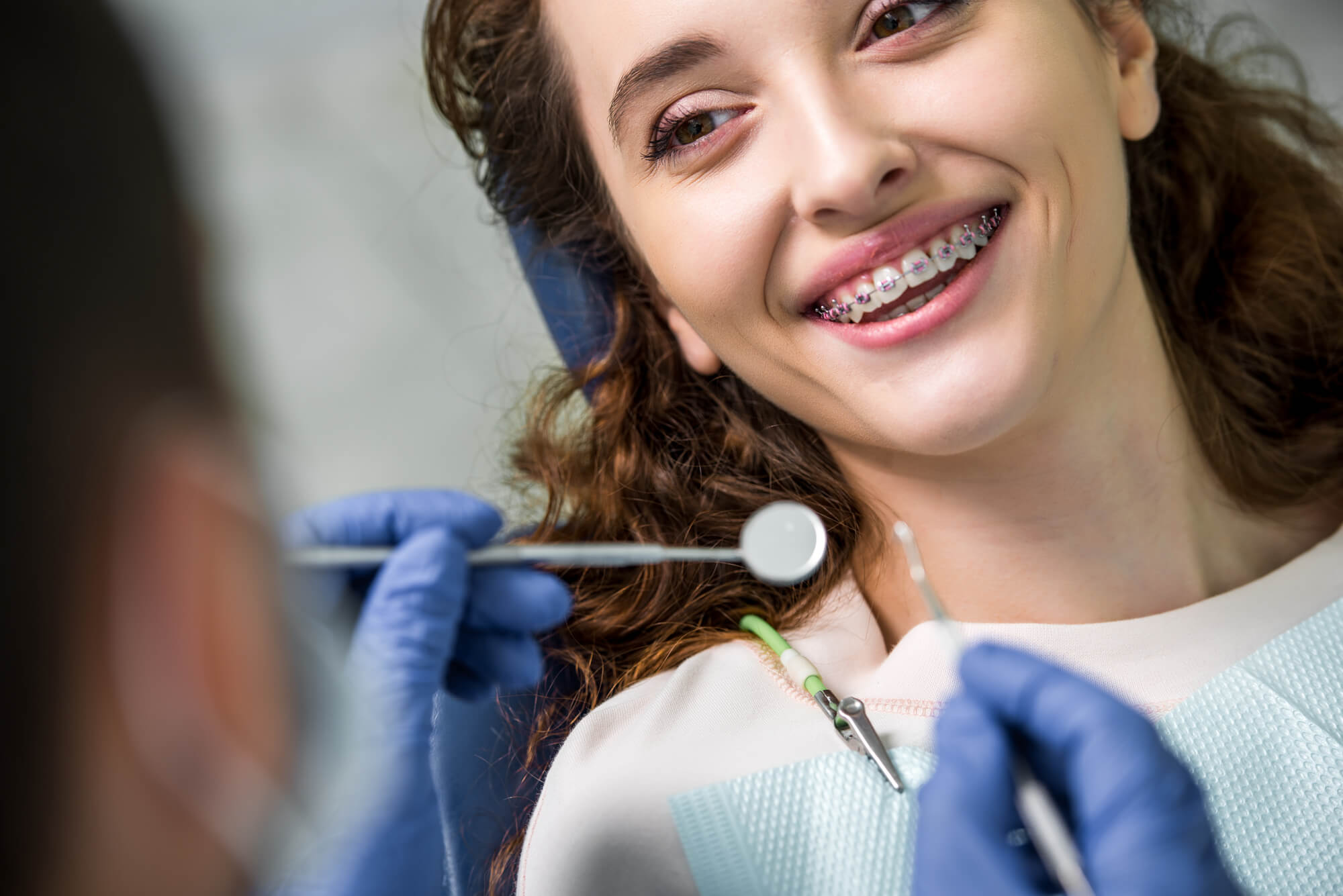 Smiling patient with braces Woodland Hills receiving orthodontic care Woodland Hills.