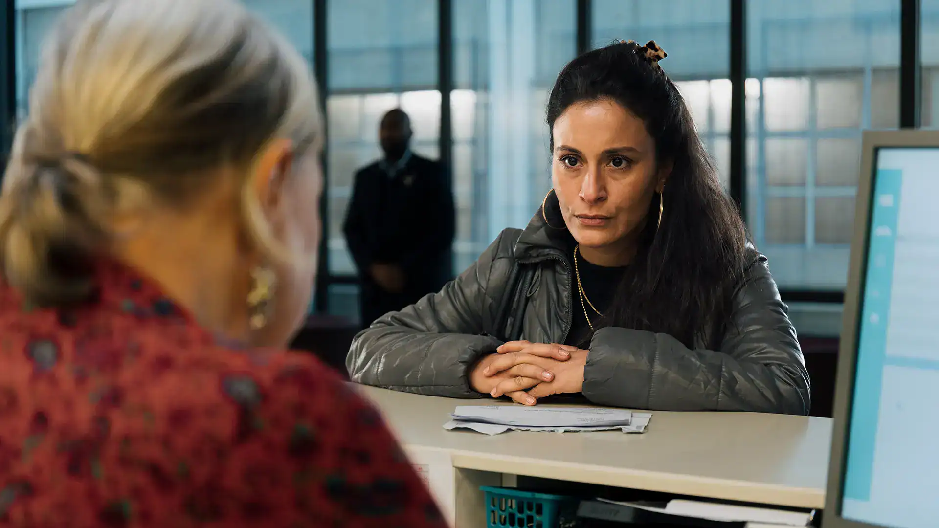 Woman being interviewed at Keplerfilm office, professional setting.