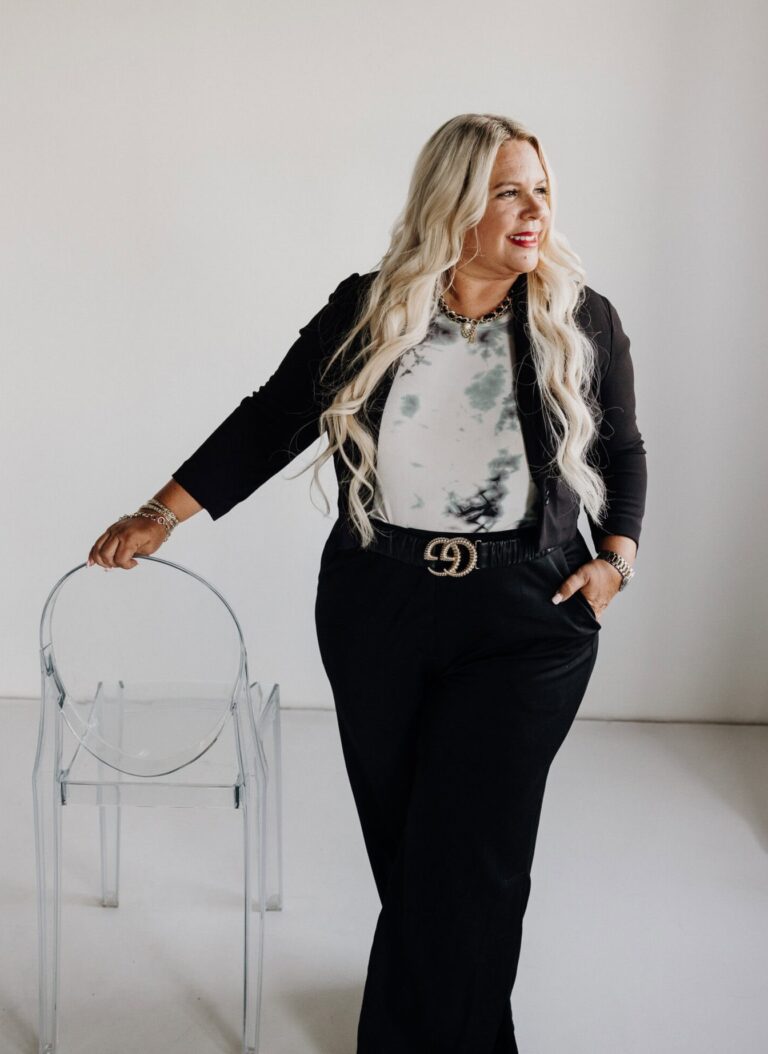 High-resolution image of Kim Caballero, a successful businesswoman, posing confidently in a modern studio setting.