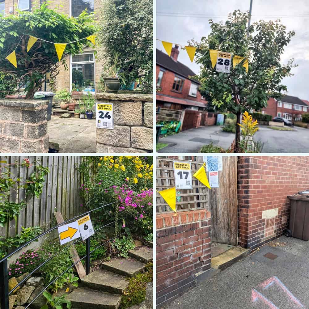 Yellow bunting and directional arrow signage marking a Kirkstall Art Trail venuea.