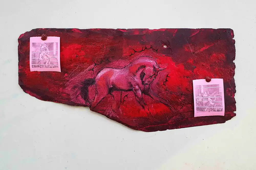 Horse mural artwork on textured red wall, part of Kirkstall Art Trail.