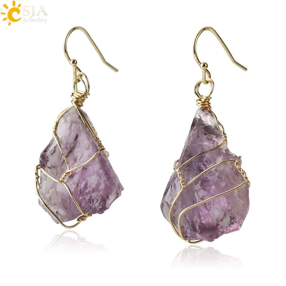 Natural Stone wire wrapped earrings featuring raw purple natural stones with a gold wire wrap and simple gold hooks. The stones have an unpolished, organic look.