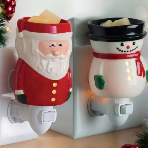 The Santa or Frosty Plugin Wax Warmers melt wax cubes in a wall outlet, adding festive charm to your space with Christmas decorations and garland.
