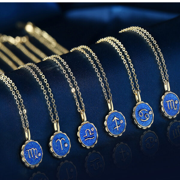 Six Copper Micro-inlaid Zodiac Couple Necklaces with blue circular pendants, each showing a unique zodiac sign, are neatly arranged on a dark blue velvet background.