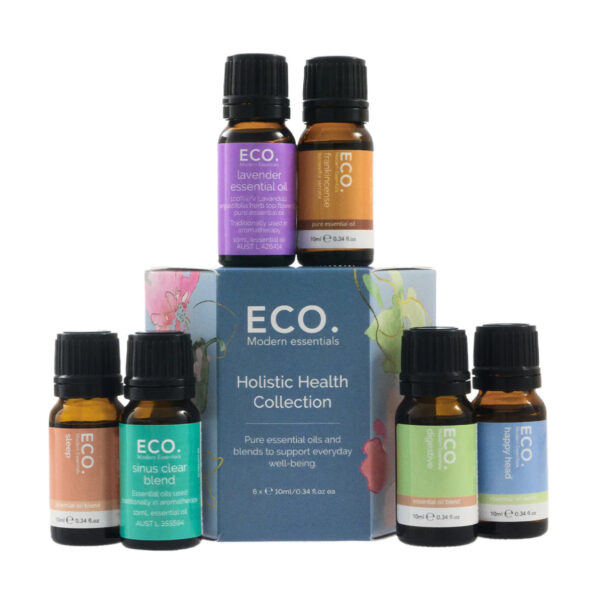 Six bottles from the Holistic Health Essential Oil Collection are arranged around its blue box, featuring blends like lavender, energy, and sinus clear for holistic wellness, all set against a white background.