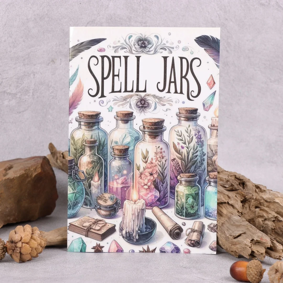 A book titled Spell Jars with an illustrated cover showing colourful jars filled with herbs, crystals, a lit candle, scrolls, feathers, and various magical items, set against a neutral background with rocks and acorns.