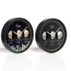 Two round wall clocks display personalized moon phases for “Mum” and “Dad,” with names, dates, and phases labeled beneath moon images. The “Mum” clock has a leafy design, while the “Dad” clock has a plain black background.