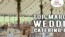 Elegant wedding reception tent set up with tables, chairs, and floral decorations for outdoor wedding catering.