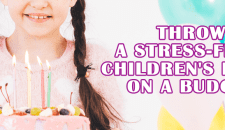 Child's birthday cake with candles for stress-free children's party planning.