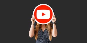 YouTube logo held by a woman representing online video content for KK Catering.