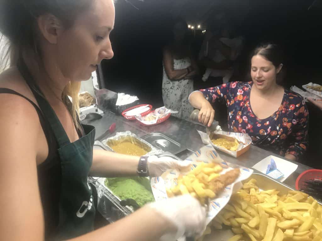 Freshly prepared homemade fish and chips served at a catering
event by KK Catering