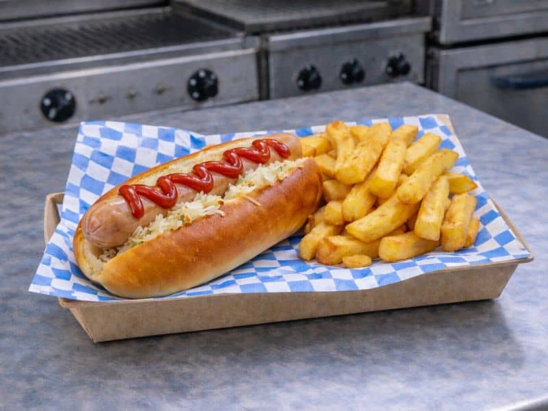 Bockwurst sausage in a baguette served by KK Catering's bratwurst van.