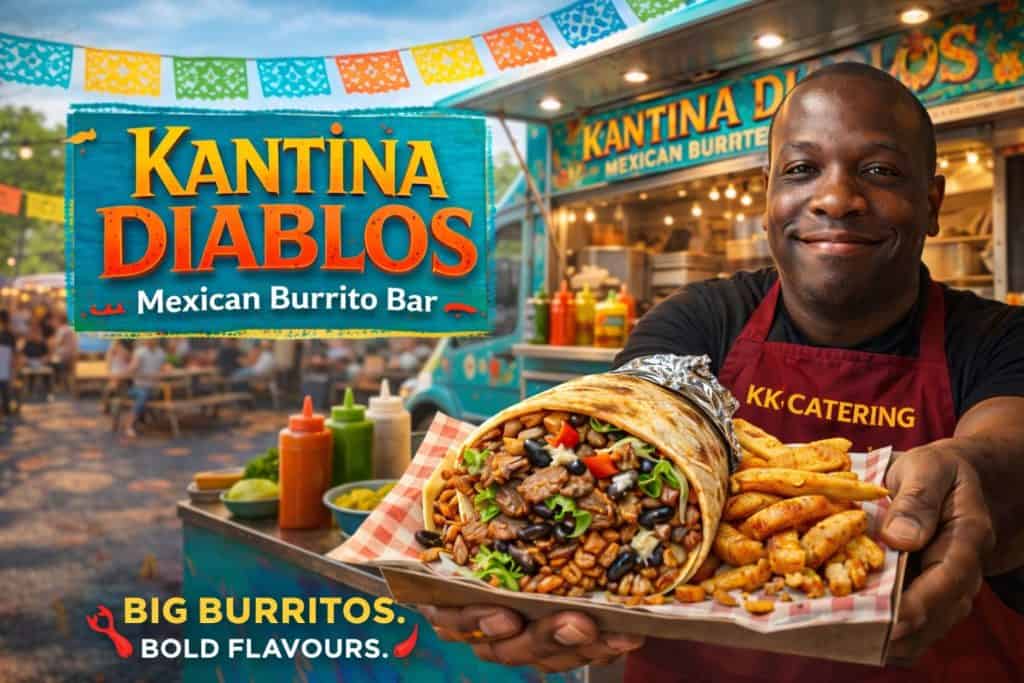 Friendly staff holding a large Mexican burrito at Kantina Diablos, outdoor setting.