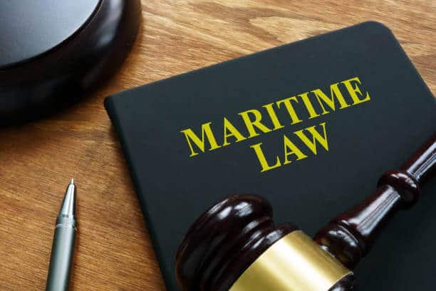 Maritime Law On a table adorned with a gavel and a book labeled 'Maritime,' the word 'maritime'