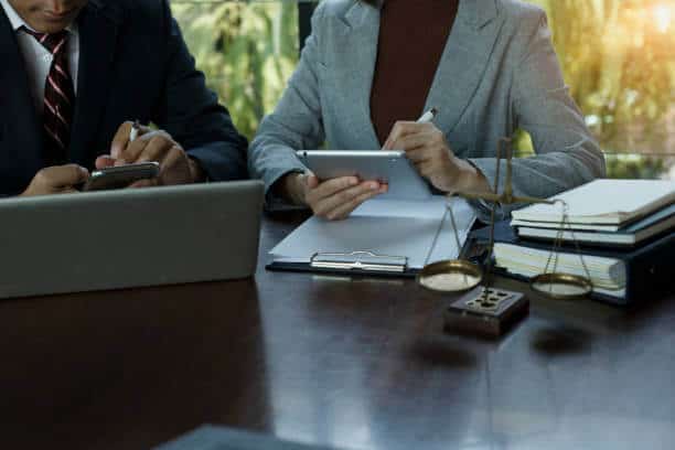 Two people are talking in an office