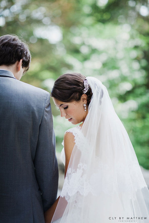 Bride and groom sharing a quiet moment during an outdoor wedding at Le Chateau Banquets