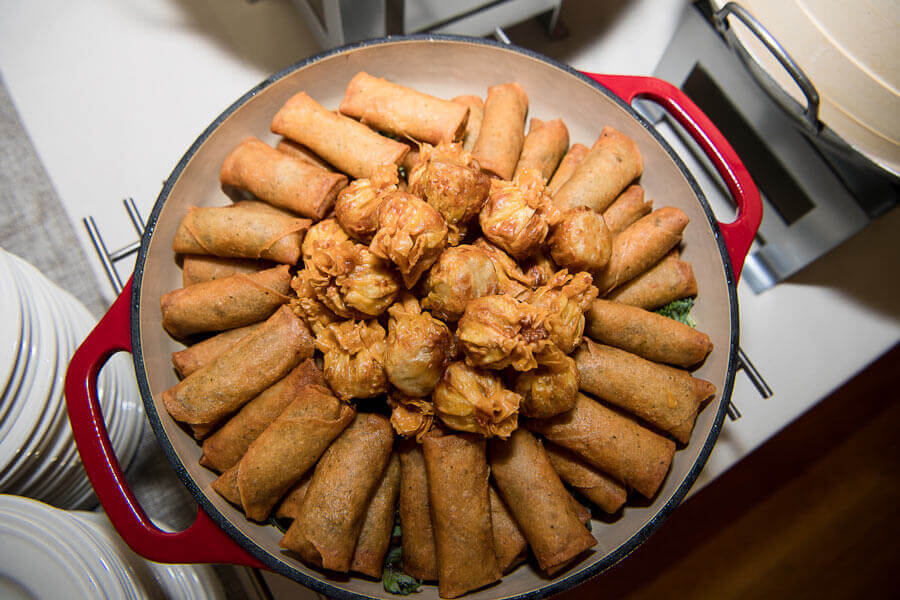 Asian station platter with crispy spring rolls and savory dumplings for banquet guests