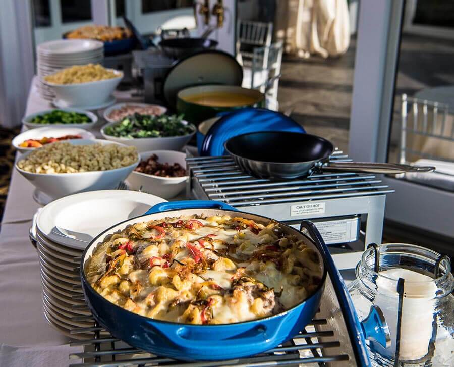 Mac and cheese station with gourmet toppings at Le Chateau Banquets reception venue