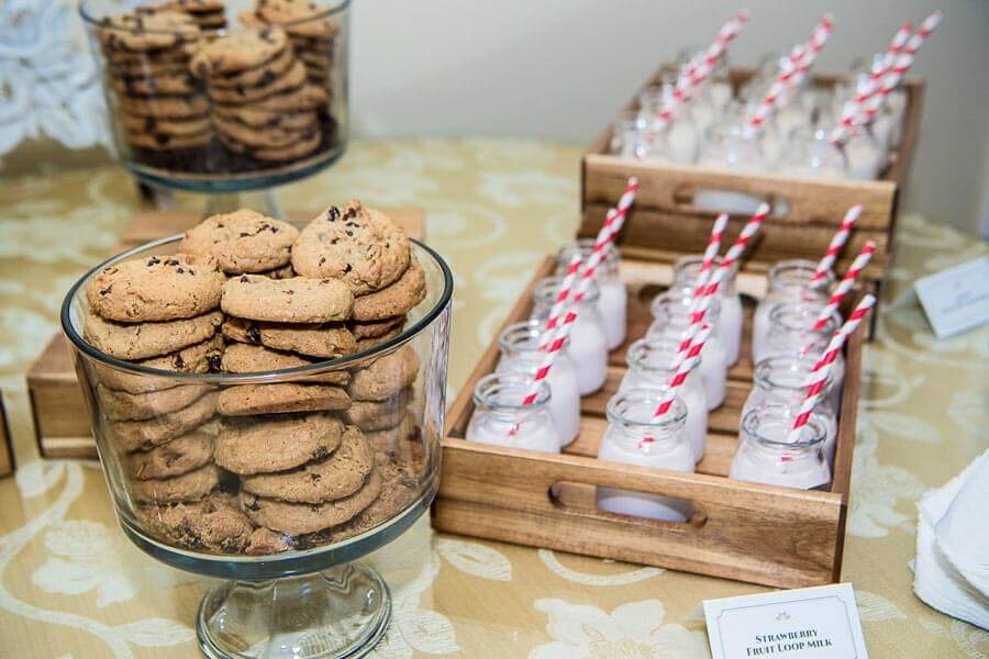 Assorted cookie jars and milk shooters served at a wedding dessert station at Le Chateau Banquets