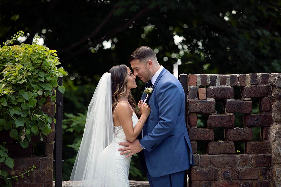Bride and groom sharing intimate moment at Le Chateau outdoor wedding venue
