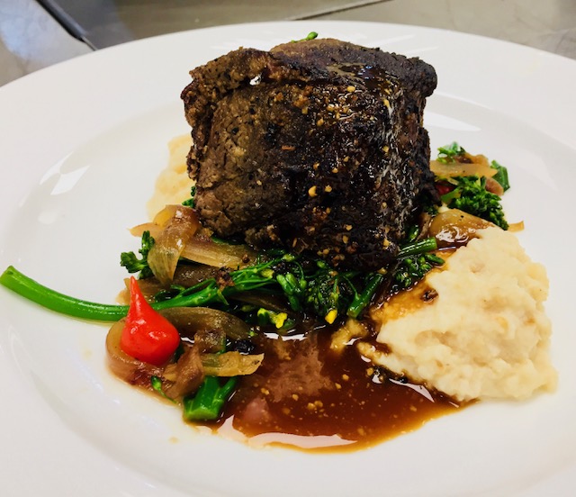 Cabernet-braised short rib with mashed potatoes and seasonal vegetables at Le Chateau Banquets