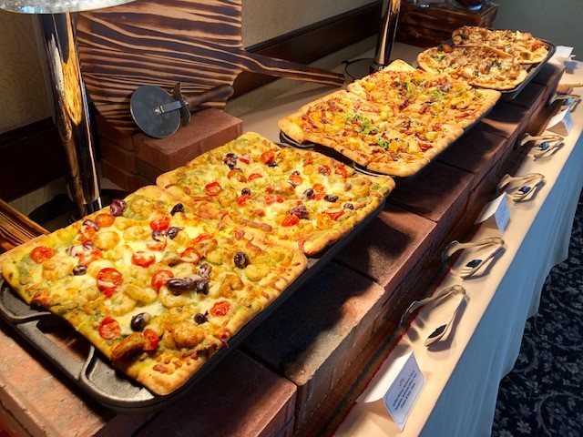 Flatbread station featuring assorted artisan flatbreads for banquet and reception catering.