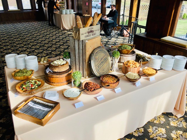 Mediterranean appetizer station with dips and artisan platters at Le Chateau Banquets