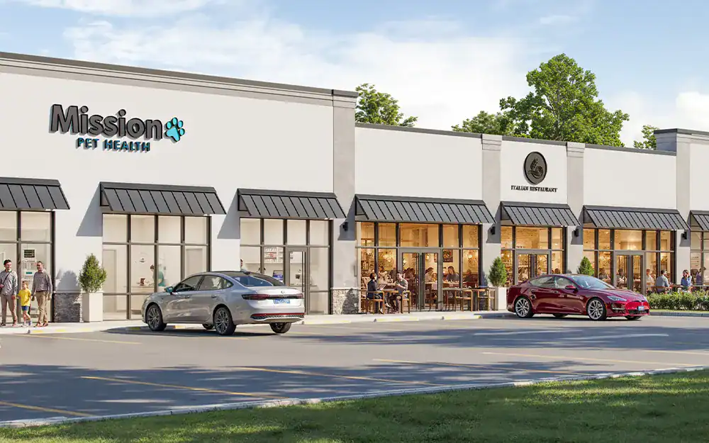 Exterior view of Mission Pet Wellness Center with parked cars and people walking by on a sunny day.