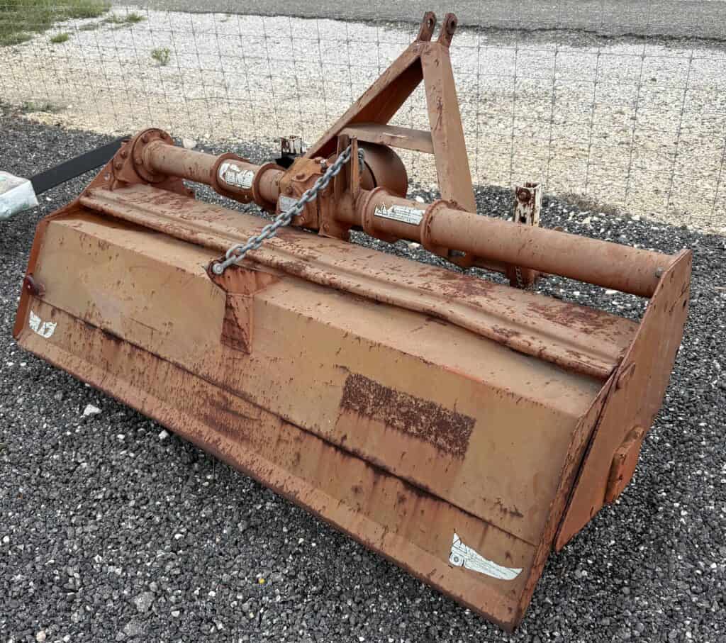 Rotary cutter attachment for tractors, ideal for land clearing and agricultural use.