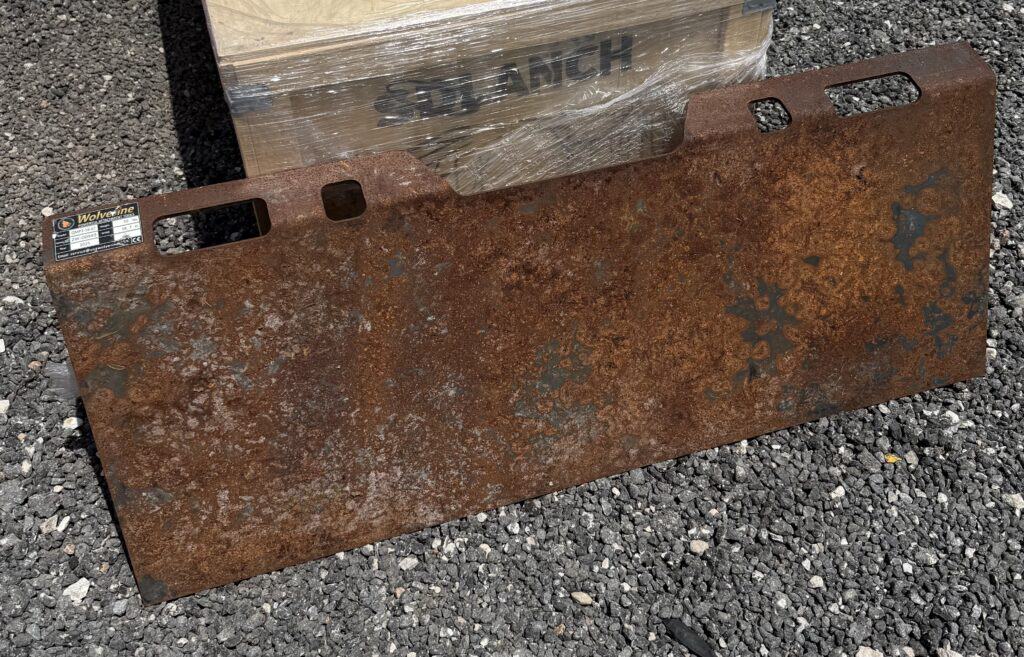 Rusty metal piece for auction at Garrett Realty & Auction.