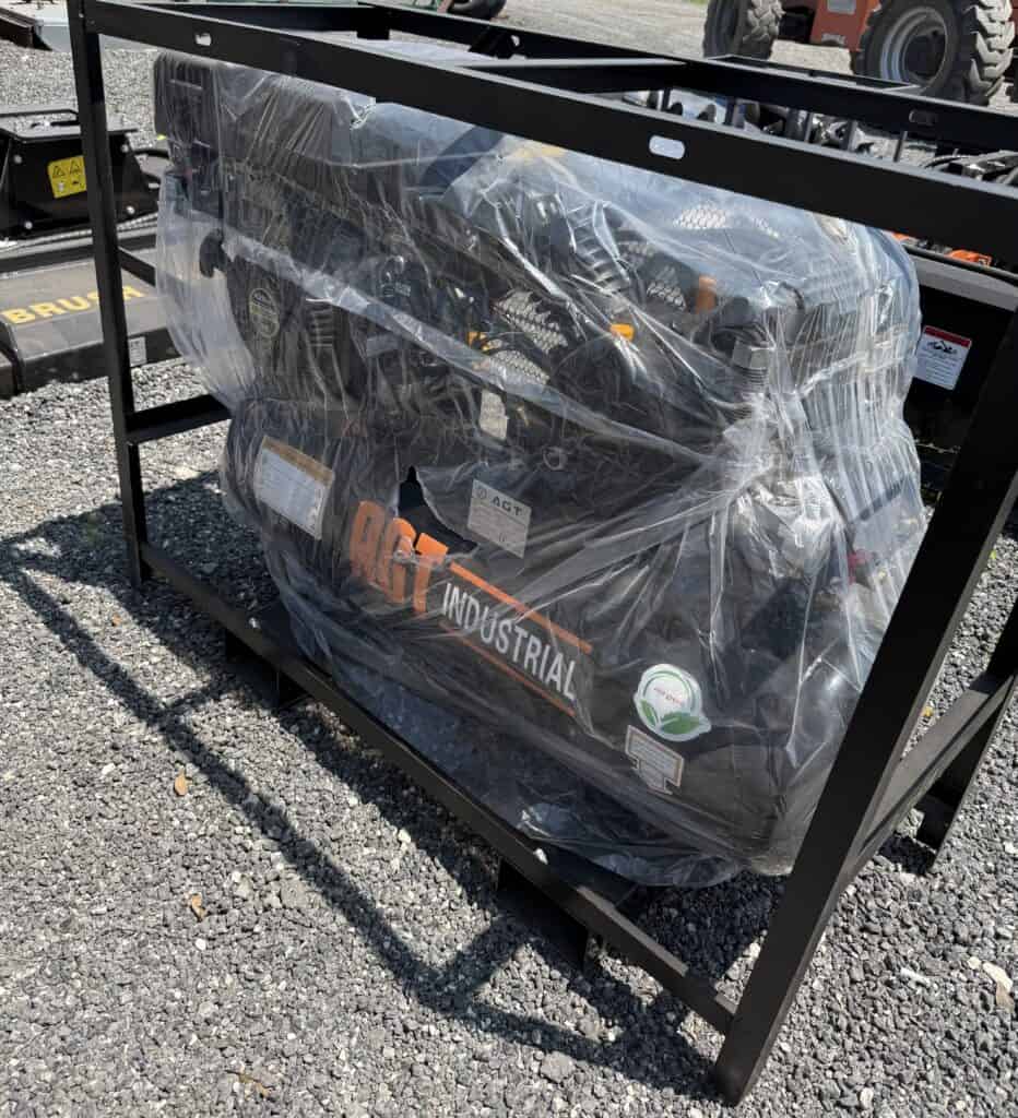 Motorcycle wrapped in plastic for protection at Garrett Realty & Auction.