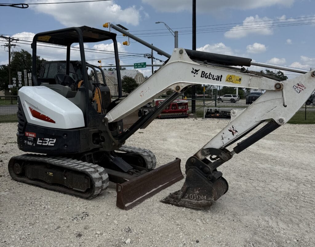 Excavator with Bobcat branding, tracked construction equipment, ideal for excavation projects.