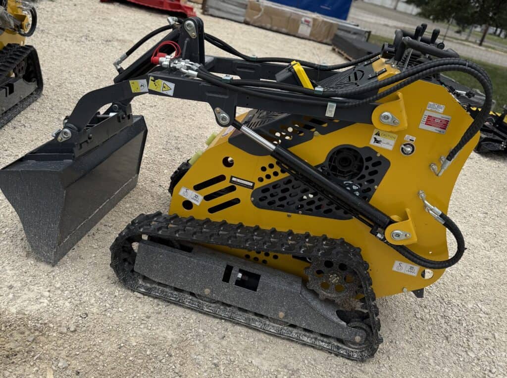 Excavator with tracks and hydraulic arm, ideal for construction and landscaping projects.