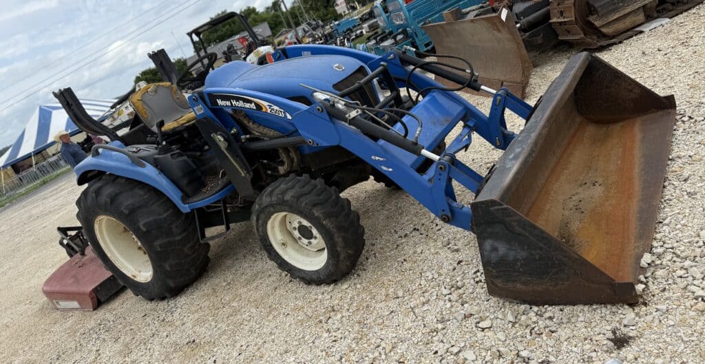 John Deere compact tractor with front loader, ideal for farm and landscaping projects. Perfect for a.
