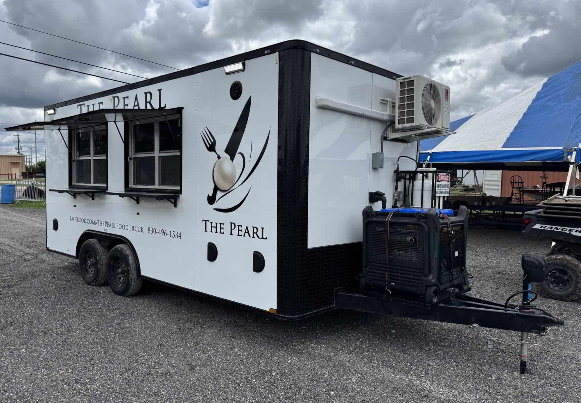 Food trailer with The Pearl logo and kitchen equipment for sale.
