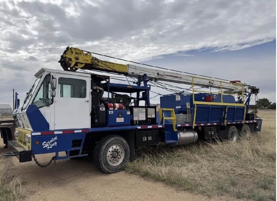 Heavy-duty drilling rig vehicle for industrial or construction use.