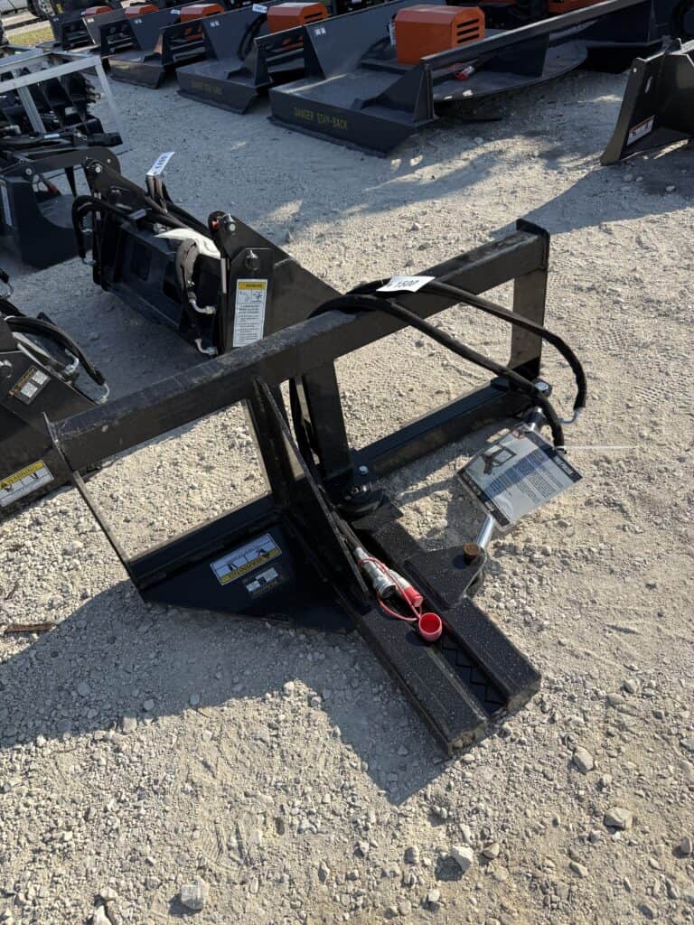 Hydraulic log splitter attachment for heavy machinery at auction.