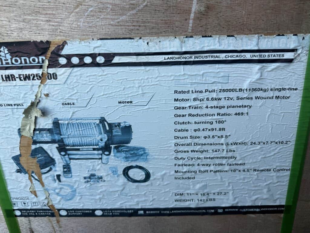 Close-up of industrial equipment auction poster with technical specifications.