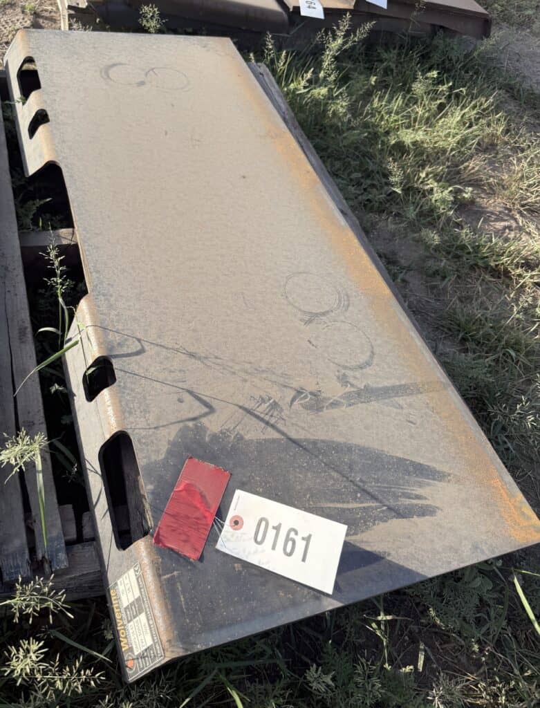Rusty steel work table for heavy equipment at auction.