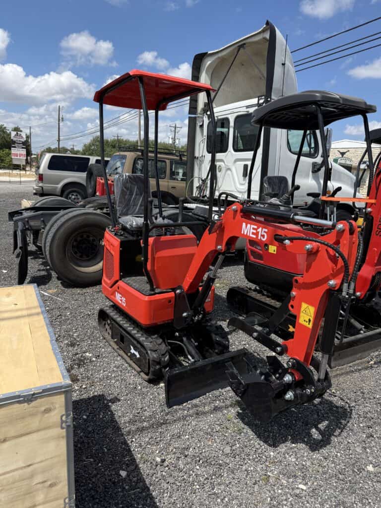 Red mini excavator with tracks at October 3rd consignment auction.
