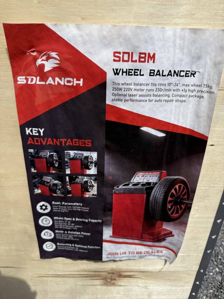 SOLBM wheel balancer with digital display and wheel mount.