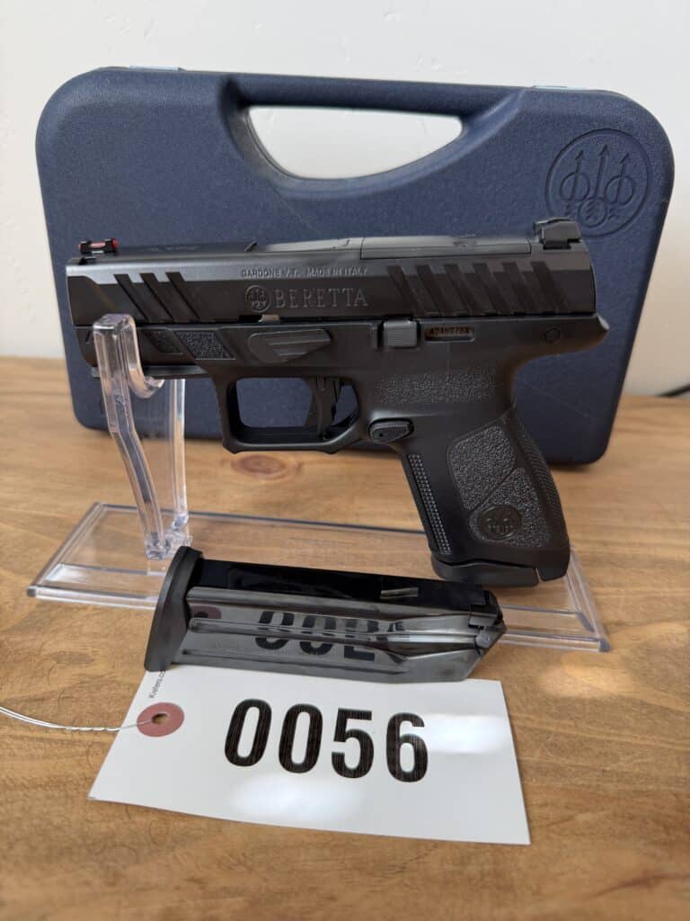 Beretta 9mm handgun with case and magazine for auction.