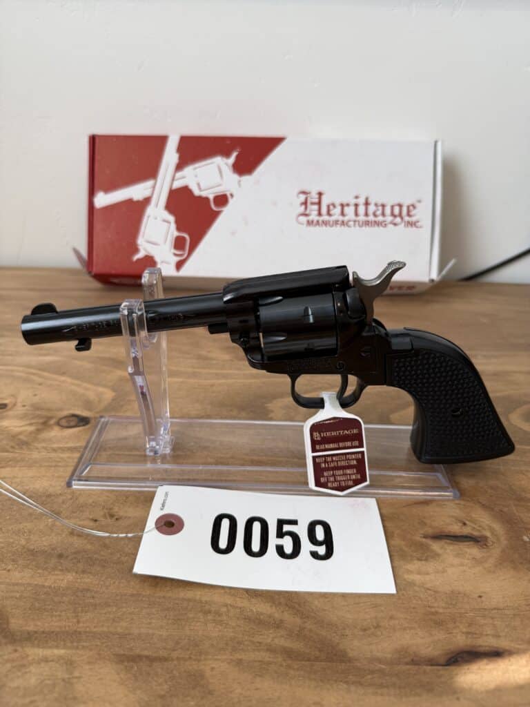 Black Heritage revolver on display with box in background.