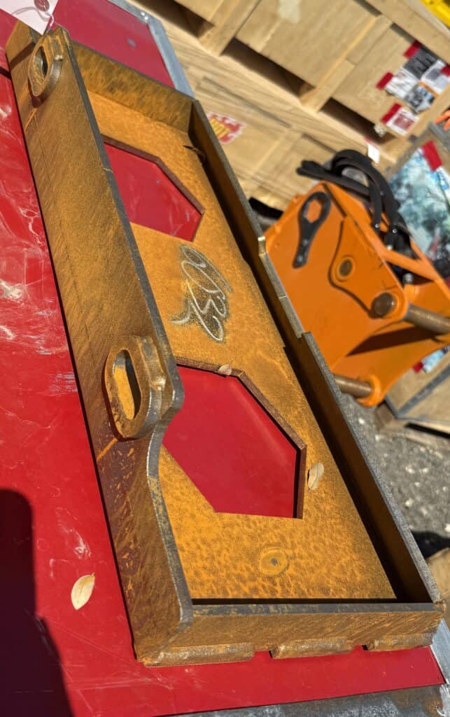 Vintage pinball machine with red and gold design for auction.